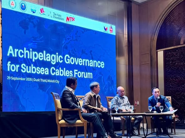 Session panelists seated beneath the Archipelagic Governance for Subsea Cables Forum screen